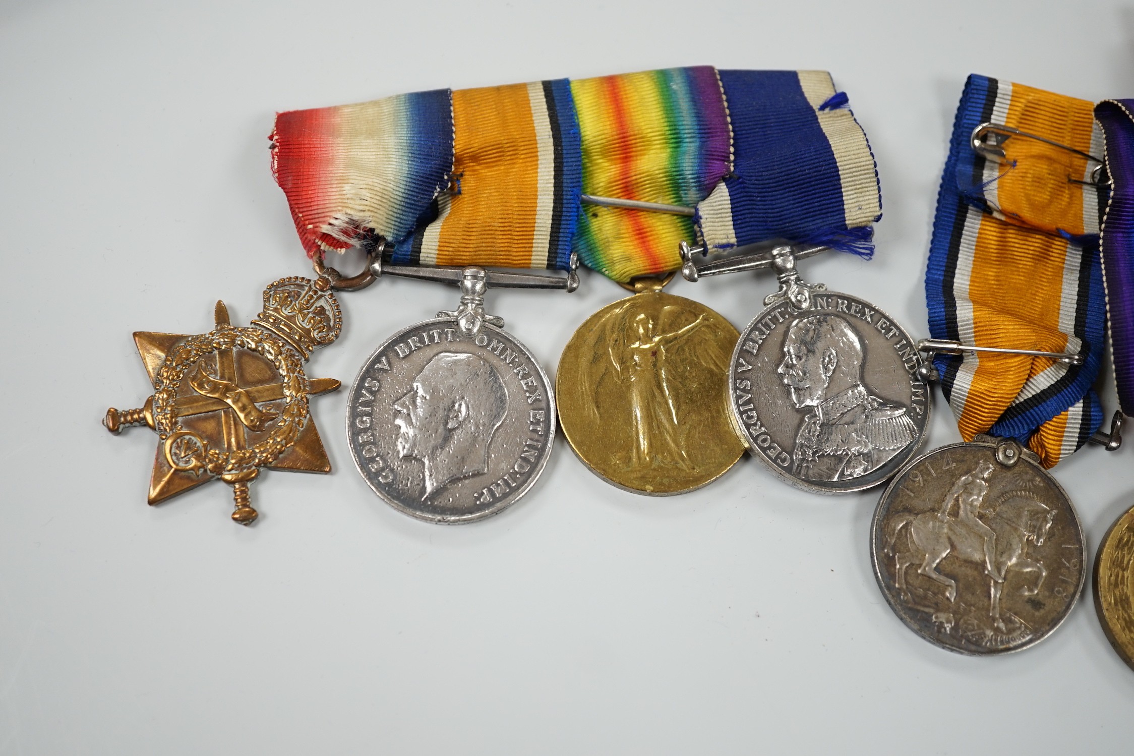 A WWI naval medal group of four with portrait photo with records and one other WWI trio